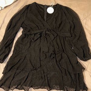 Black long sleeve dress with polka dot detail